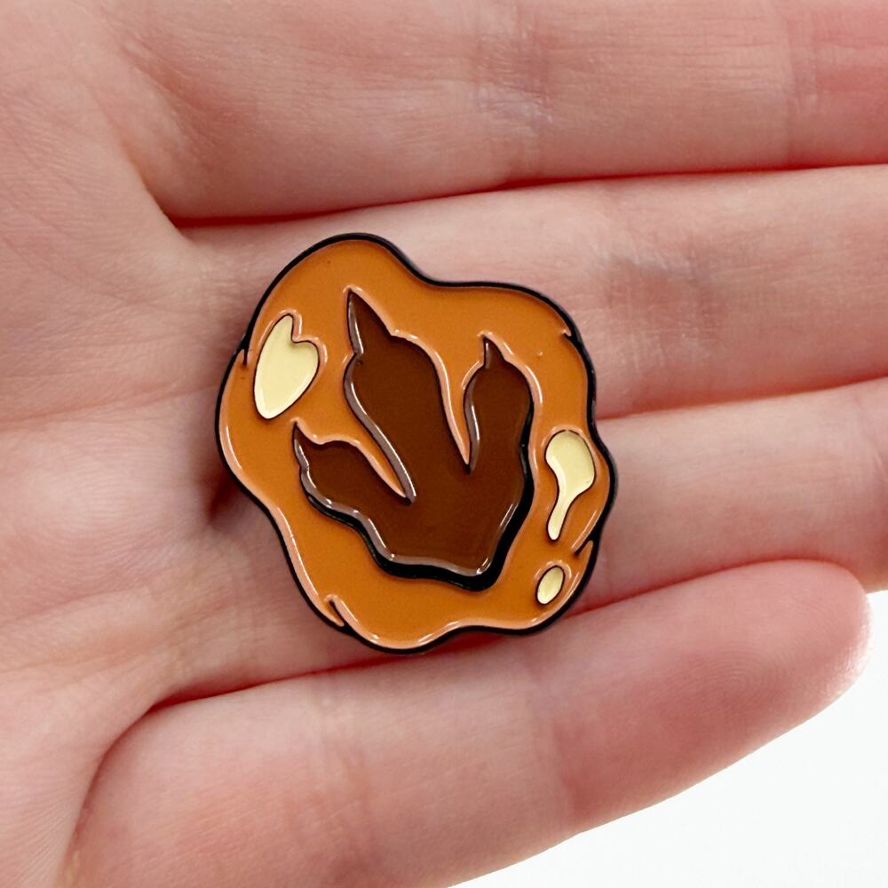 Dinosaur Footprint Fossil Skull Pin